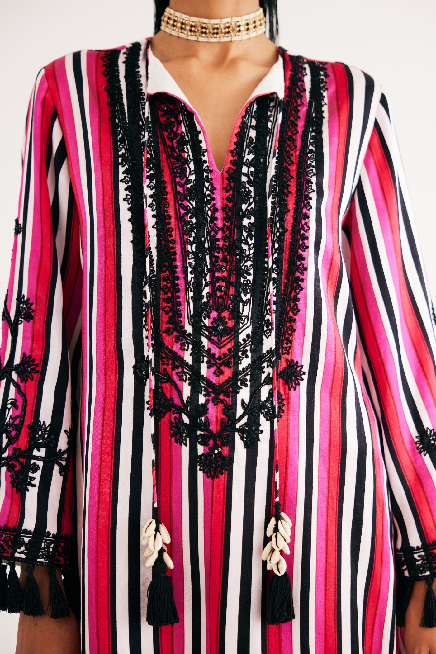 Rani pink Stripe Mashroo Satin Embroidered Tunic and Black Narrow Pants, Black Silk Velvet Narrow Pants, Mashru cotton satin fabric, Flared sleeves with tassels Hand embroidered with sequins, Tassle at sleeves, BeTrue, Be True